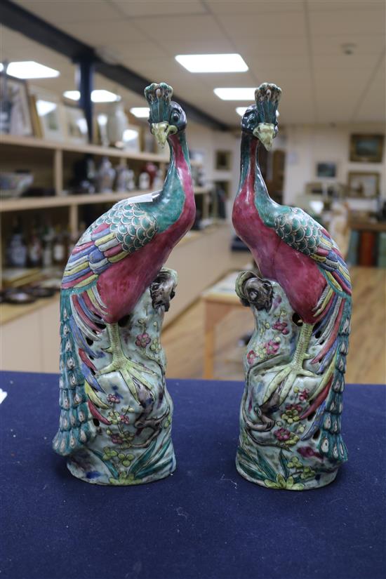 A pair of Chinese famille rose models of peacocks, 19th century Height 32cm